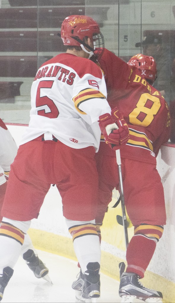 Brothers Drew and Tyler Dorantes of the Ferris hockey team showed signs of a sibling rivalry in the Crimson and Gold scrimmage this season when Tyler pinned his older brother against the boards.