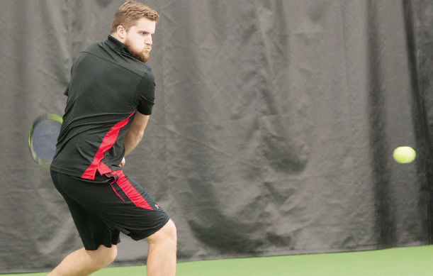 Ferris State junior Alex Brown eyes down the ball before hitting a backhand in a home match earlier this season.