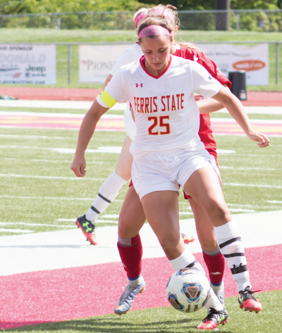 Senior defender Meredith Smith plays a ball along the sidelines at Top Taggart Field.