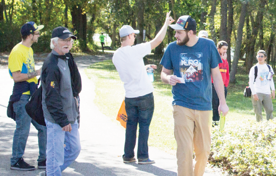 Supporters of Ferris United Against Cancer gathered to play two rounds of disc golf on Sunday in support of a Ferris surveying engineering student whose son has a brain tumor.