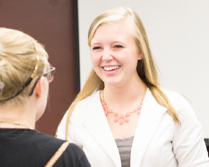 Stephanie Mellinger of Northwestern Mutual was present at the mixer, laughing and interacting with Ferris business students.