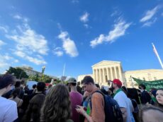 A crowd of people gather outside the Supreme Court building in Washington DC to protest the overturning of Roe V. Wade.